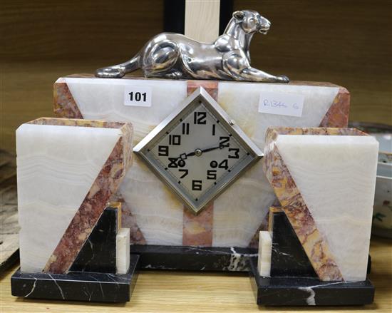 An Art Deco panther clock set